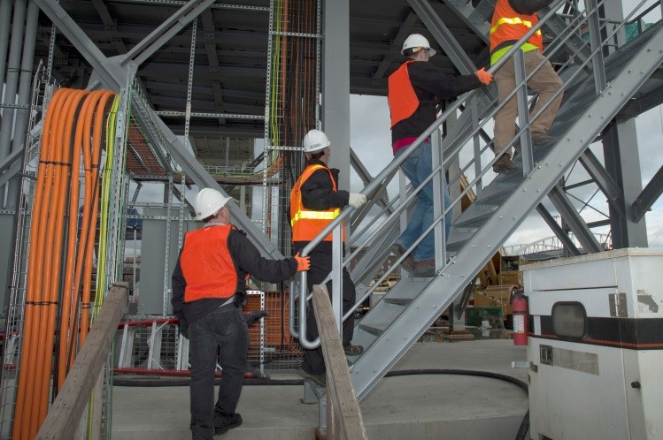 Photo of workers climbing stairs